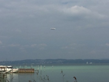 Lunch and a view of Lake Bodensee with a zeppelin in the sky overhead.